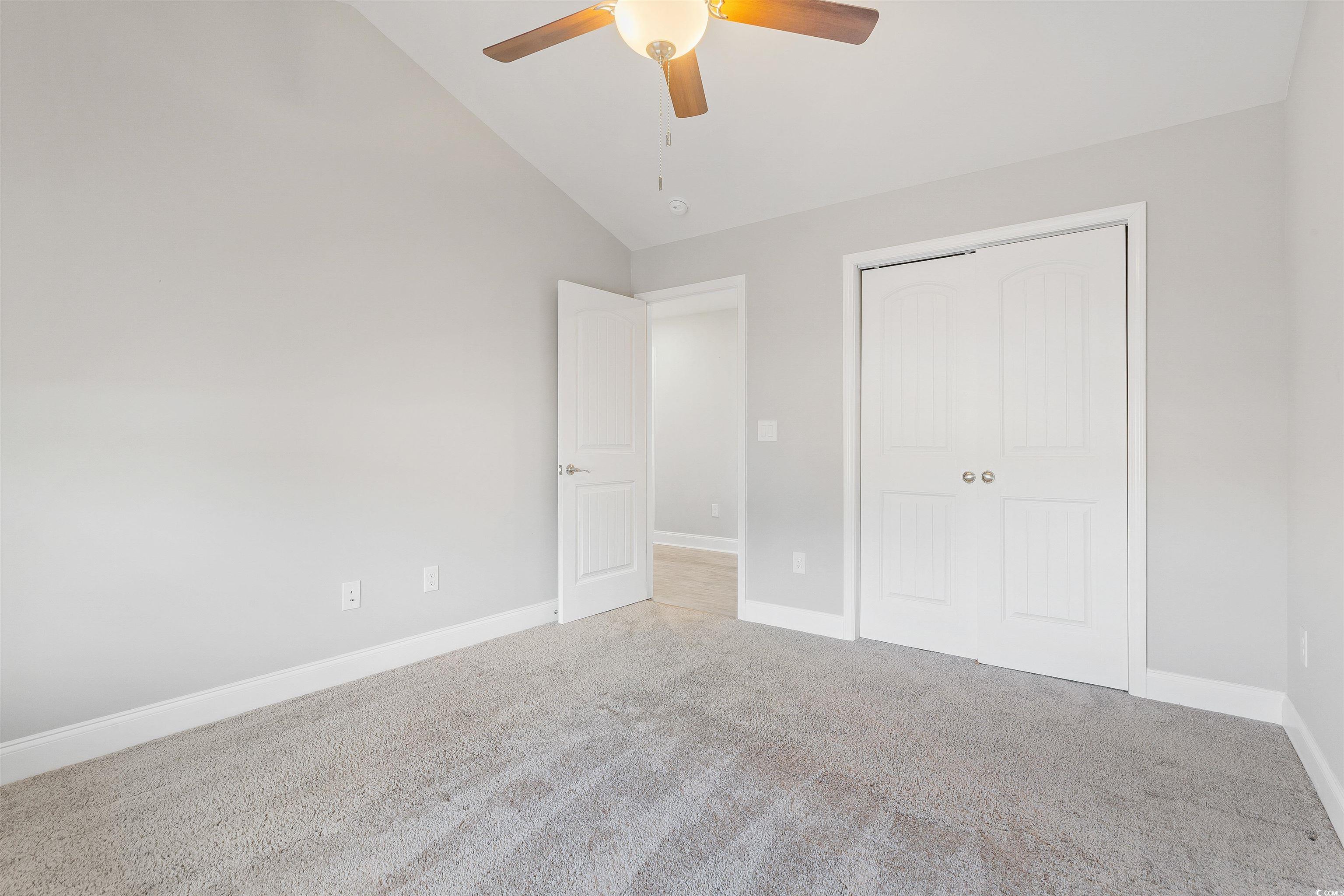 317 Marsh Tacky Loop Myrtle Beach, SC 29588 - Photo 21 of 29 Unfurnished bedroom with ceiling fan, light colore