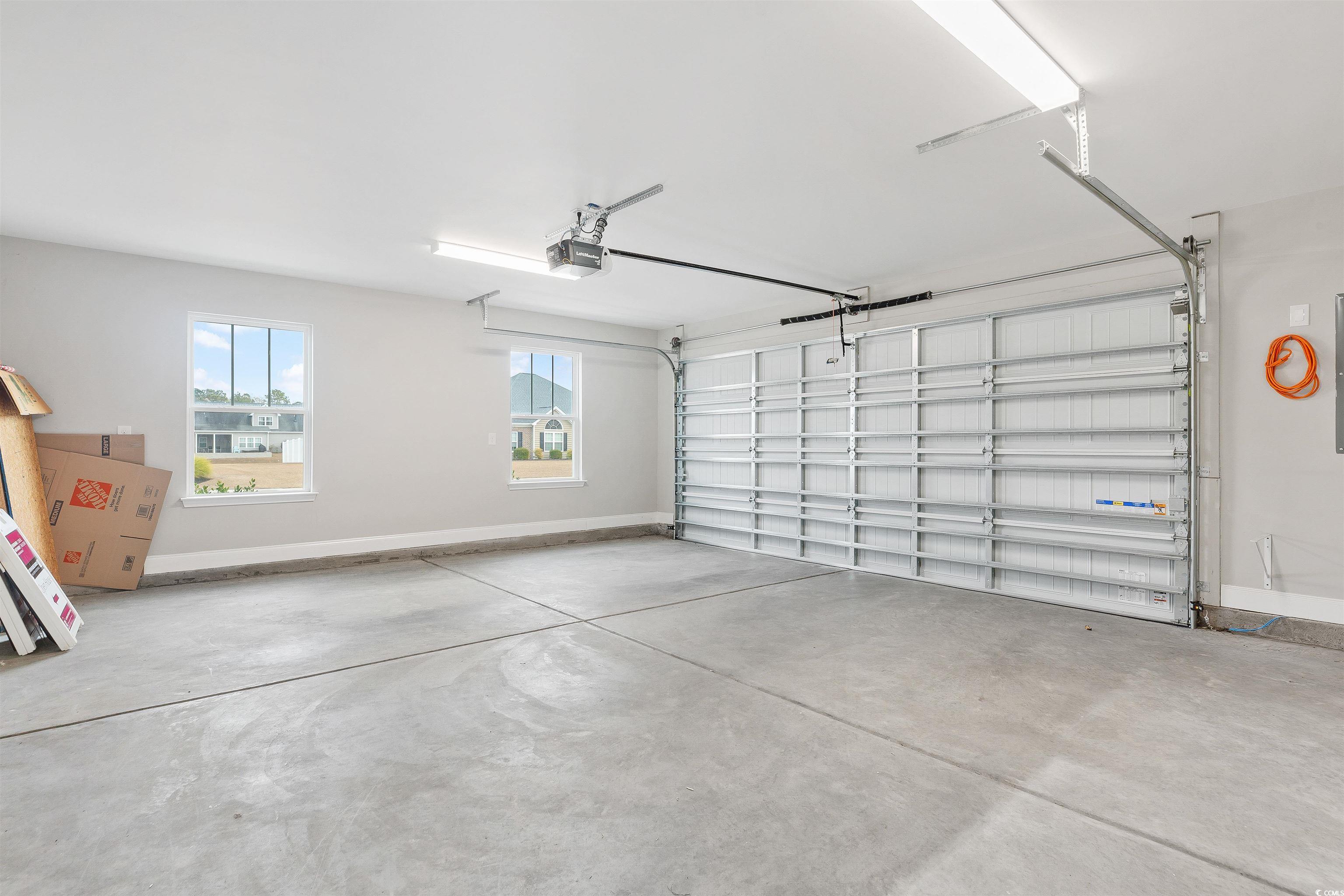 317 Marsh Tacky Loop Myrtle Beach, SC 29588 - Photo 24 of 29 Garage with a garage door opener