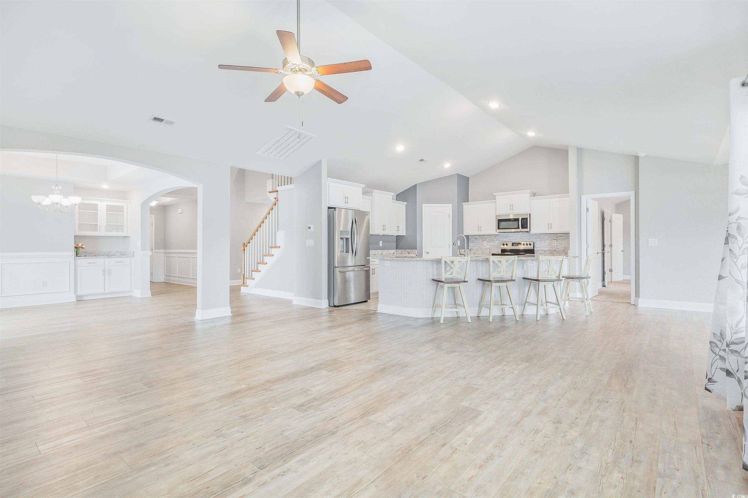 317 Marsh Tacky Loop Myrtle Beach, SC 29588 - Photo 5 of 29 Living room with sink, light hardwood / wood-style
