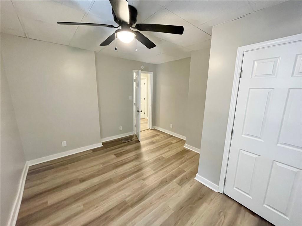 223 East Falls Street, Unit 1B New Castle, PA 16101 - Photo 14 of 14 a view of an empty room with wooden floor