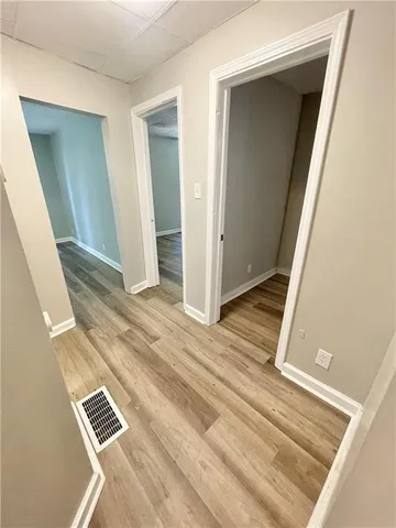 an empty room with wooden floor