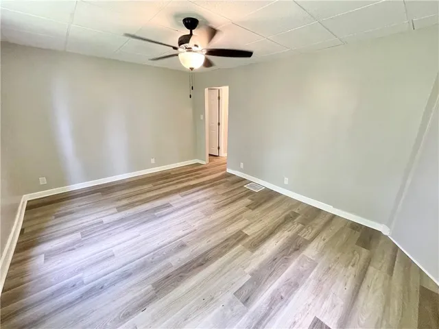 a view of room with a ceiling fan