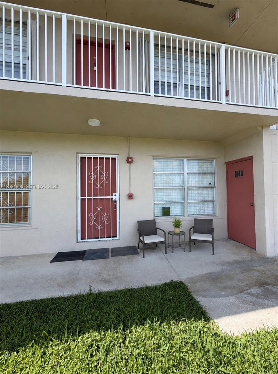 12860 Southwest 43rd Drive, Unit 146B Miami, FL 33175 - Photo 2 of 12 a view of a house with backyard porch and sitting area