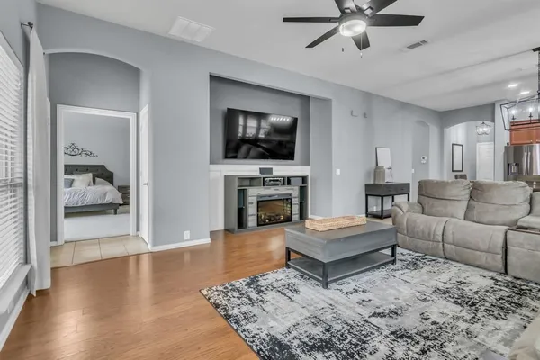 a living room with furniture and a fireplace