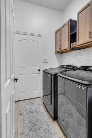 a kitchen with stainless steel appliances granite countertop a stove a microwave and cabinets