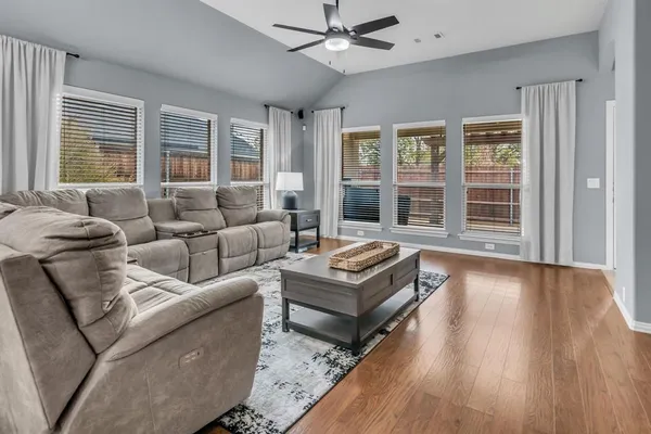 a living room with furniture and windows