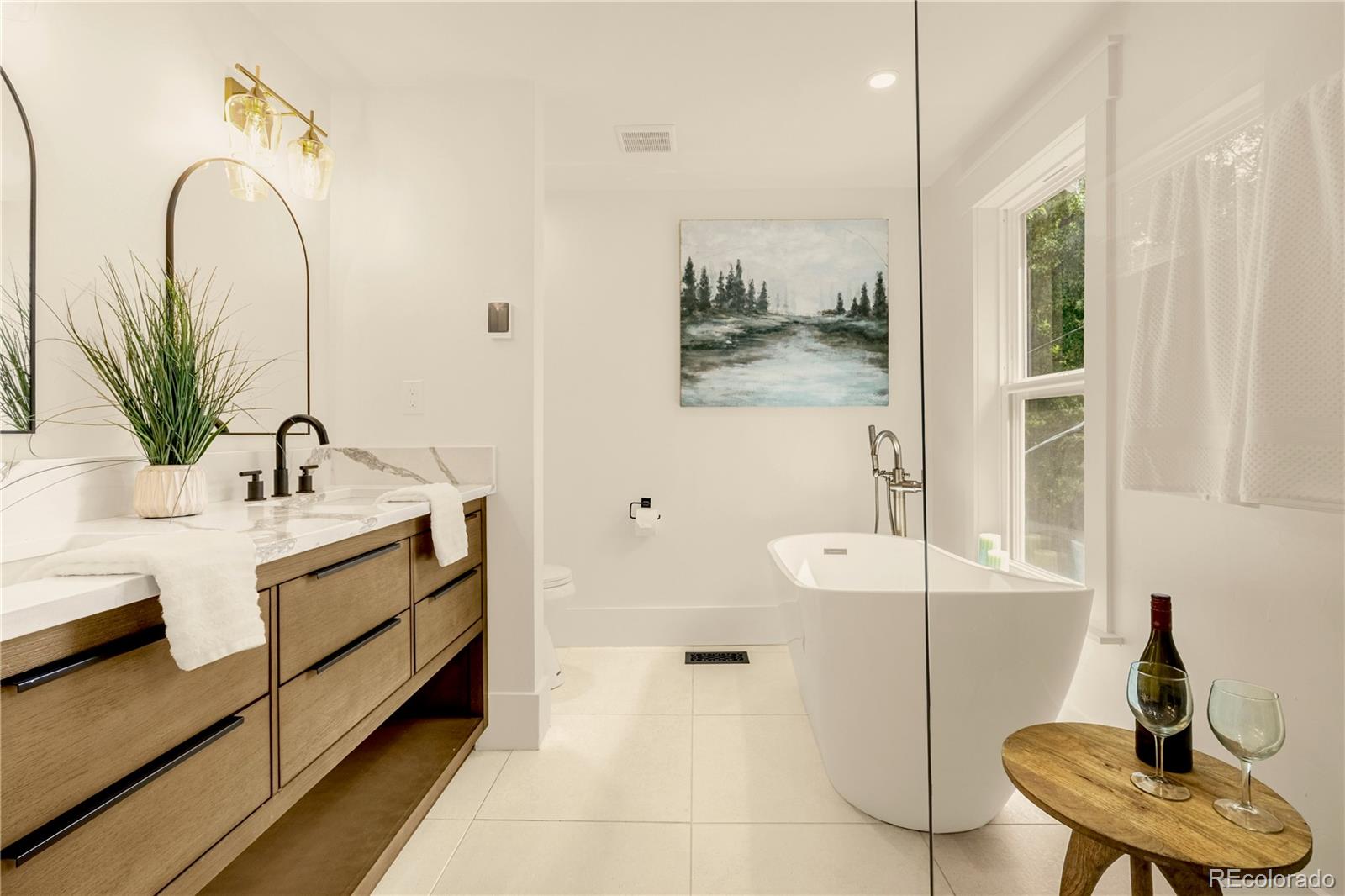 200 West Cheyenne Road Colorado Springs, CO 80906 - Photo 16 of 24 a bathroom with a sink and a mirror