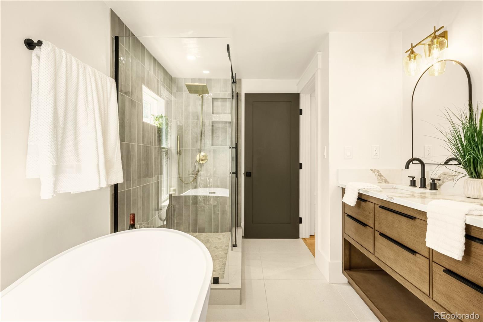 200 West Cheyenne Road Colorado Springs, CO 80906 - Photo 17 of 24 a bathroom with a sink and a mirror