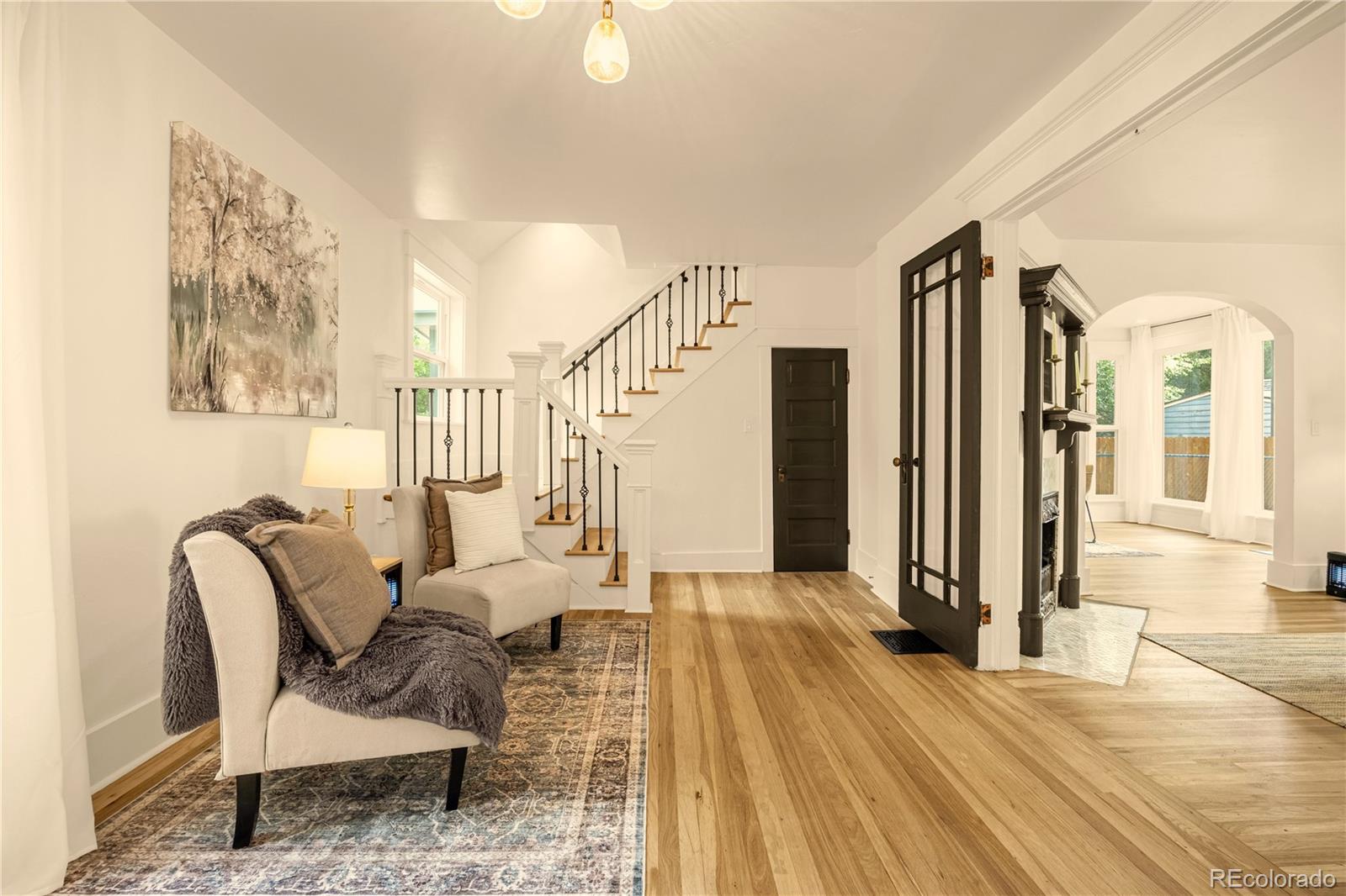 200 West Cheyenne Road Colorado Springs, CO 80906 - Photo 4 of 24 a living room with furniture and a wooden floor