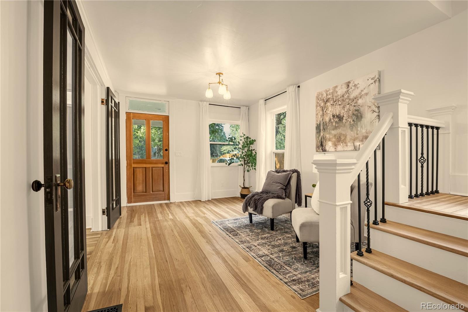 200 West Cheyenne Road Colorado Springs, CO 80906 - Photo 5 of 24 a living room with furniture and wooden floor