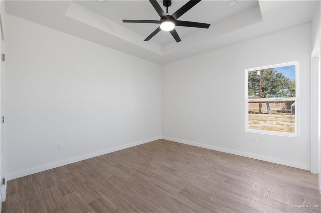 2900 Gabriel Street, Unit 4 Mission, TX 78574 - Photo 7 of 14 an empty room with a window and a fan