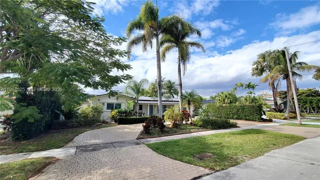 a view of swimming pool with a patio