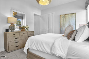 1111 Masters Place Way Durham, NC 27703 - Photo 20 of 37 a bedroom with a bed and a lamp on dresser