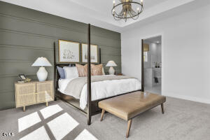 1111 Masters Place Way Durham, NC 27703 - Photo 8 of 37 a bedroom with a bed and a chandelier