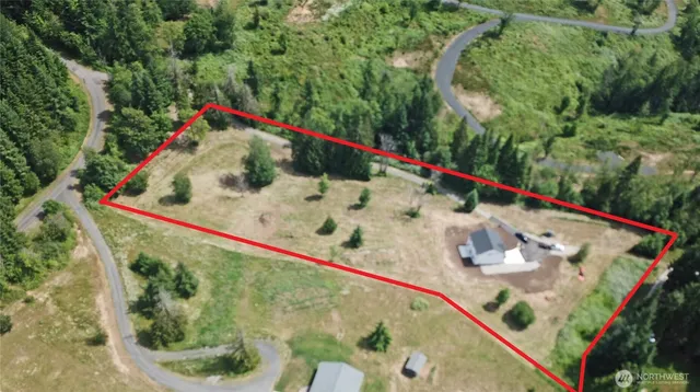 a wooden view of water pool with an outdoor seating