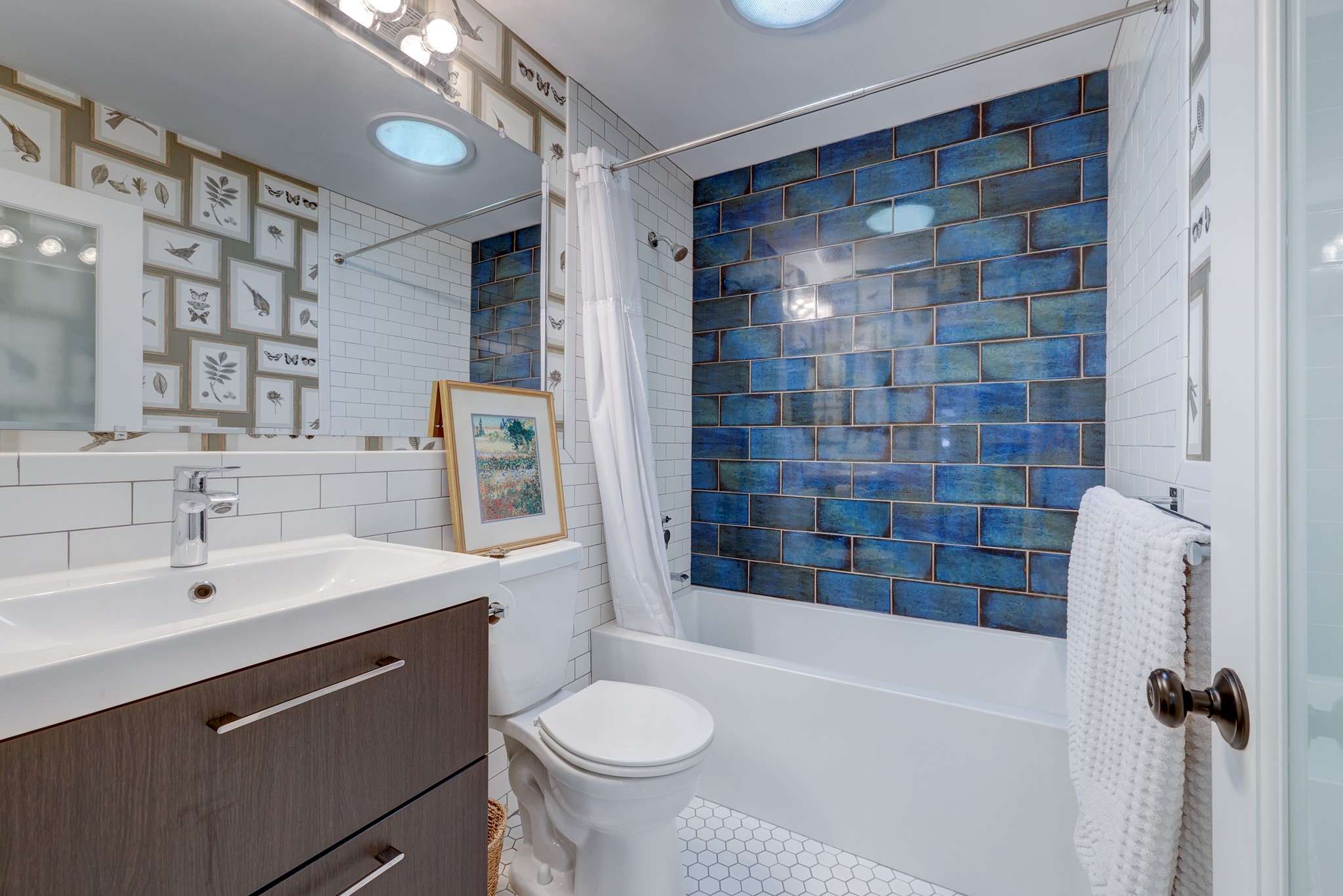 2306 Santa Maria Street Austin, TX 78702 - Photo 12 of 17 a bathroom with a sink a toilet and shower