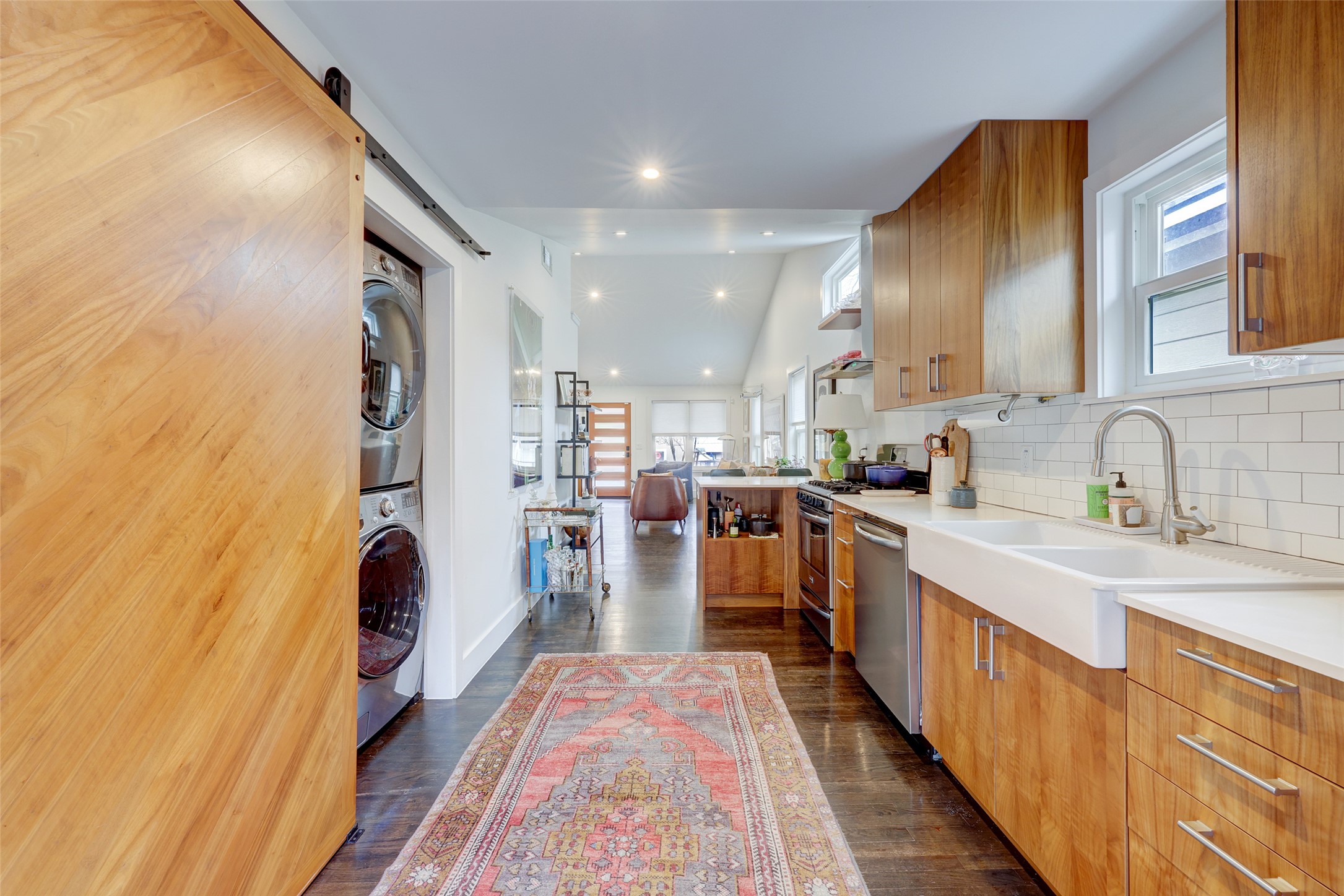 2306 Santa Maria Street Austin, TX 78702 - Photo 5 of 17 a kitchen with stainless steel appliances granite countertop lots of counter top space and wooden floor
