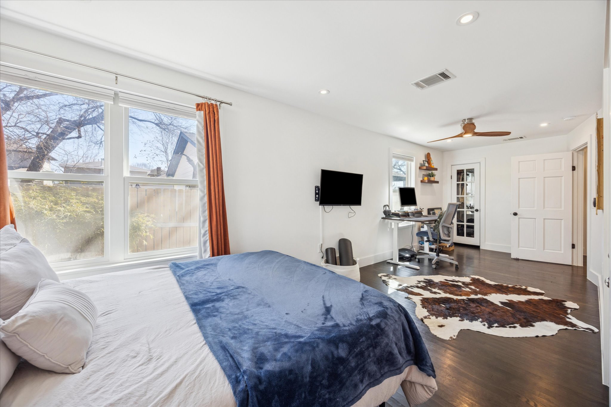 2306 Santa Maria Street Austin, TX 78702 - Photo 9 of 17 a bed room with a bed and a television