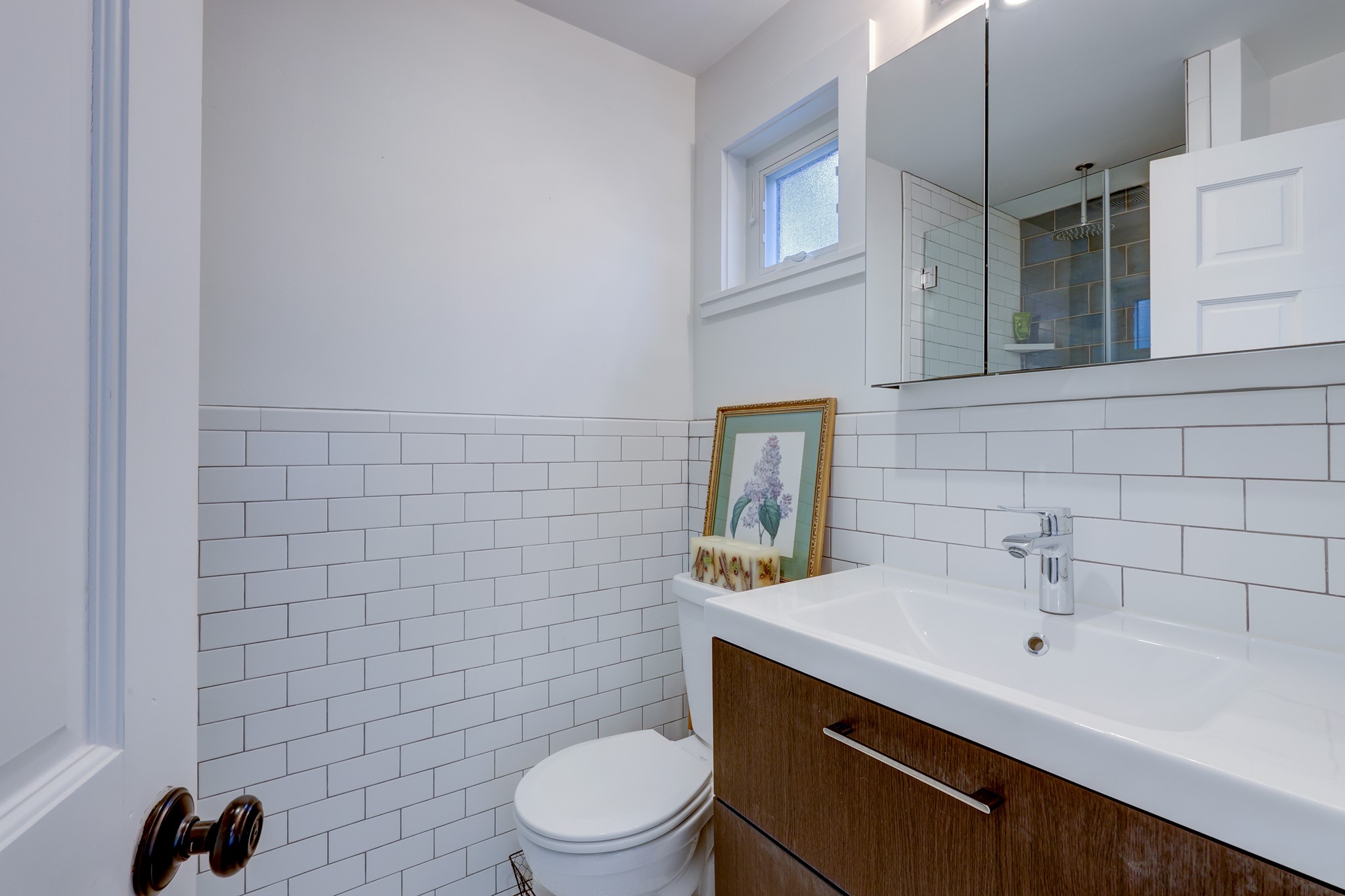 2306 Santa Maria Street Austin, TX 78702 - Photo 10 of 17 a bathroom with a sink a toilet and shower