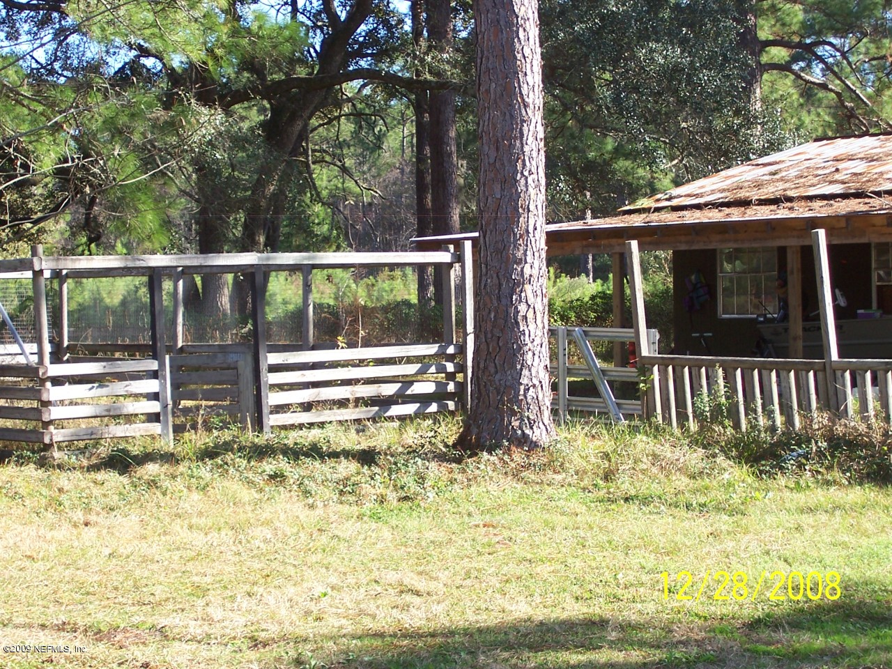 44170 Commanchee Road Callahan, FL 32011 - Photo 3 of 5 a view of a house with a small yard