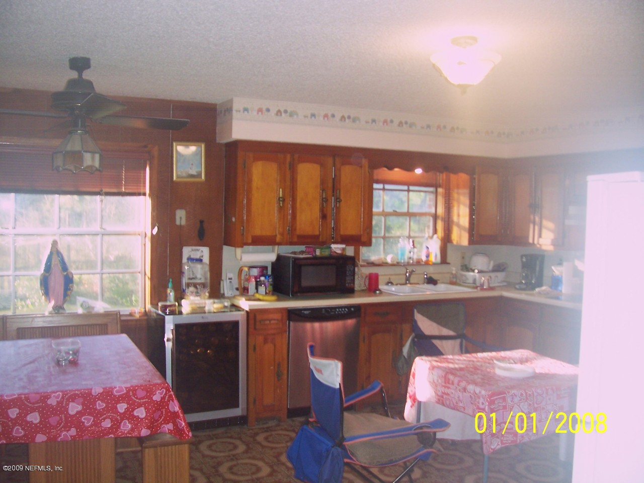 44170 Commanchee Road Callahan, FL 32011 - Photo 5 of 5 a kitchen with a sink stove and cabinets