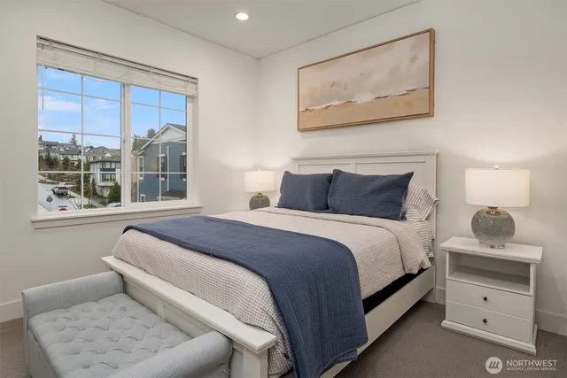 a bedroom with a bed and window