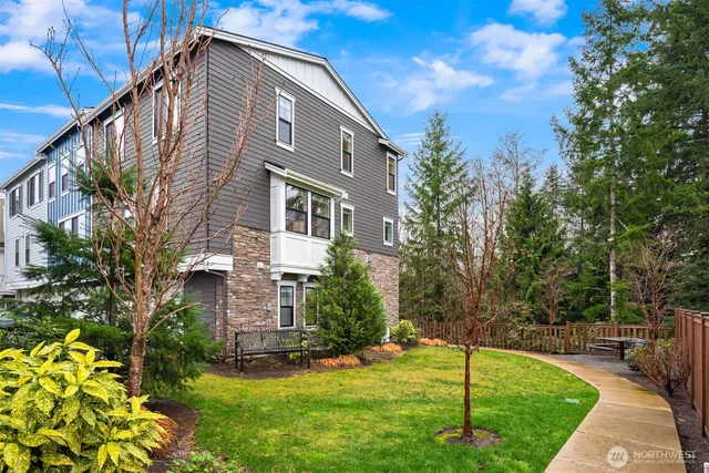 a backyard of a house with lots of green space