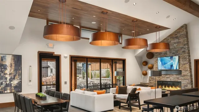 a living room with furniture and a floor to ceiling window