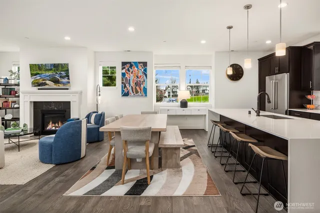 a large kitchen with a table and chairs