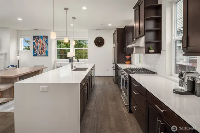 a kitchen with counter top space cabinets and stainless steel appliances