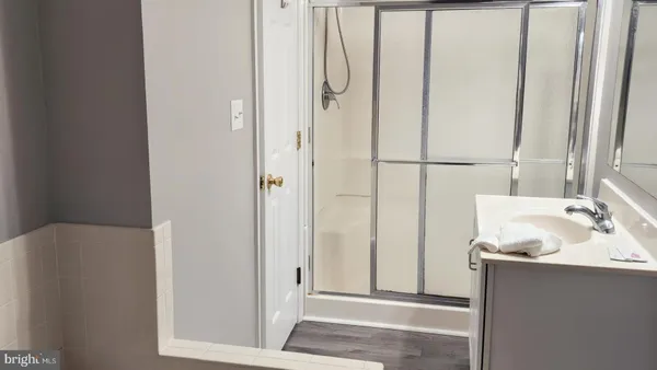 a white toilet sitting next to a white sink