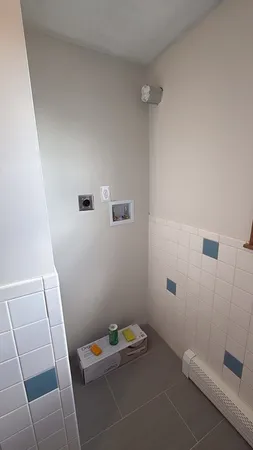 a bathroom with a sink and shower