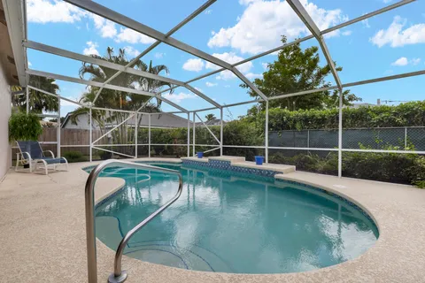 a view of a kitchen with a sink and cabinets