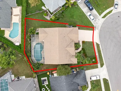 an aerial view of residential houses with outdoor space