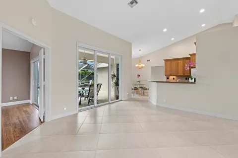 a kitchen with stainless steel appliances granite countertop a sink refrigerator and cabinets