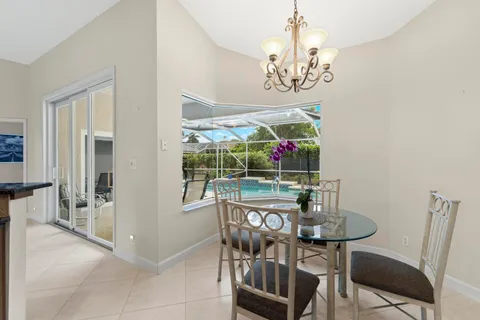 a kitchen that has a sink and a stove in it