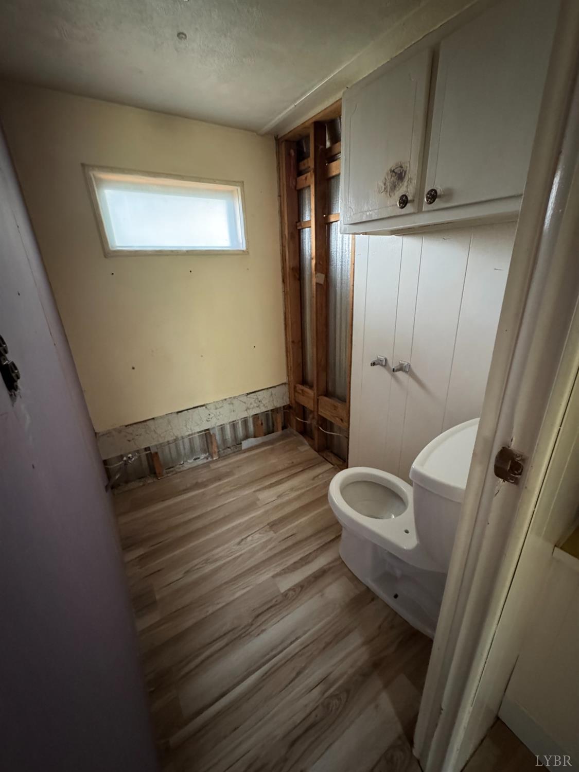 2417 Hunting Lodge Road Schuyler, VA 22969 - Photo 12 of 24 a bathroom with a sink mirror vanity and toilet