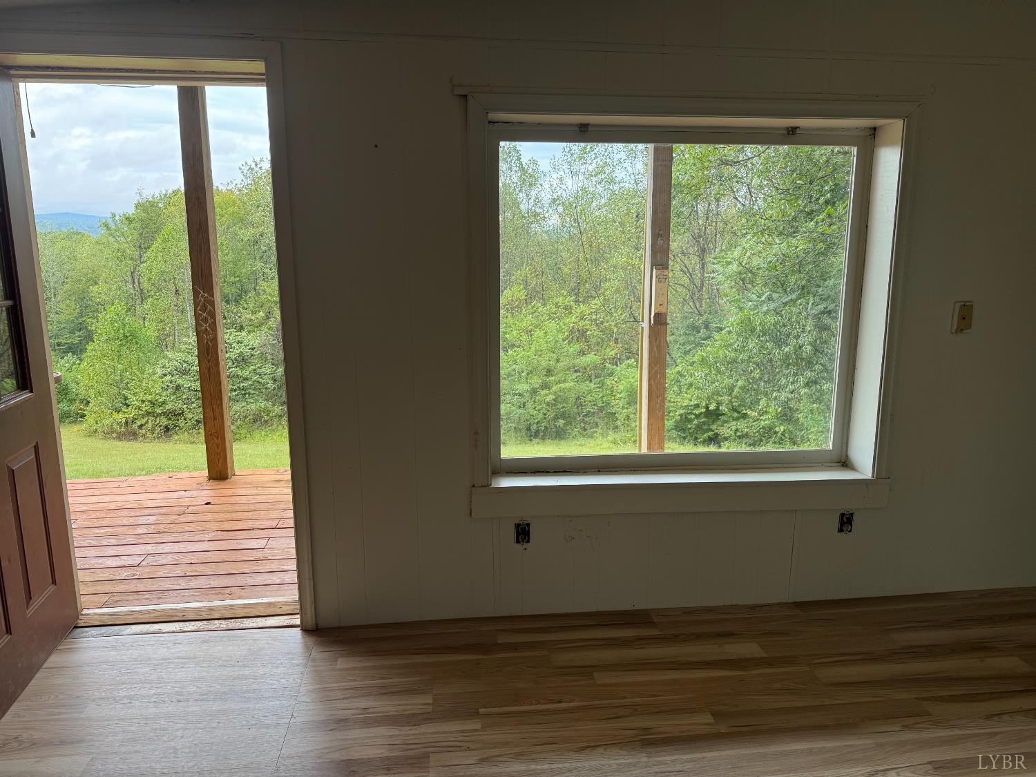 2417 Hunting Lodge Road Schuyler, VA 22969 - Photo 16 of 24 a view of an empty room with wooden floor and a window