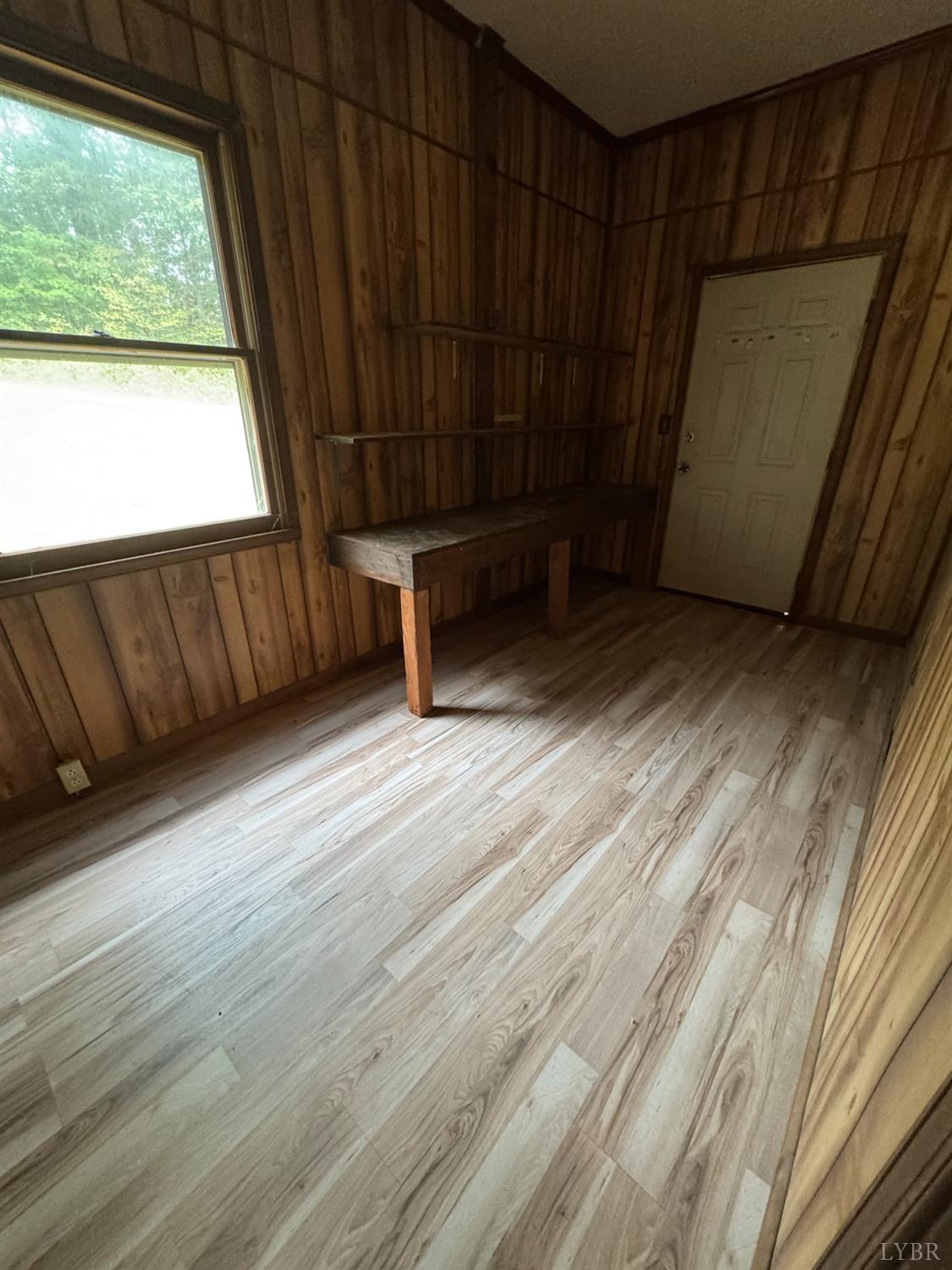 2417 Hunting Lodge Road Schuyler, VA 22969 - Photo 17 of 24 a view of a room with wooden floor and furniture
