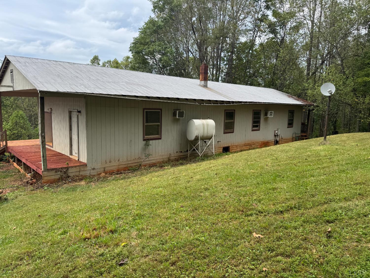 2417 Hunting Lodge Road Schuyler, VA 22969 - Photo 7 of 24 a backyard of a house with table and chairs