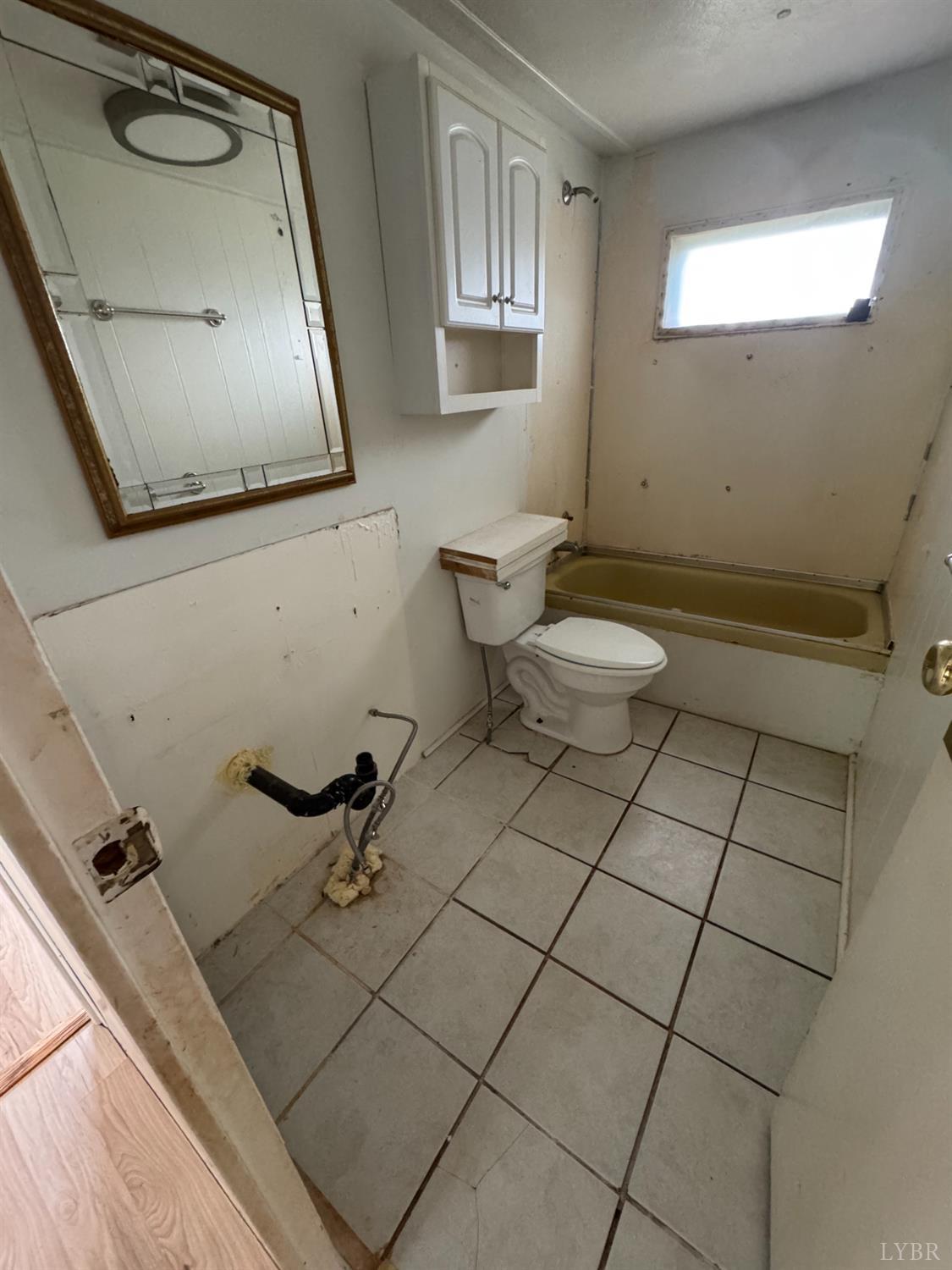 2417 Hunting Lodge Road Schuyler, VA 22969 - Photo 8 of 24 a bathroom with a sink mirror and toilet