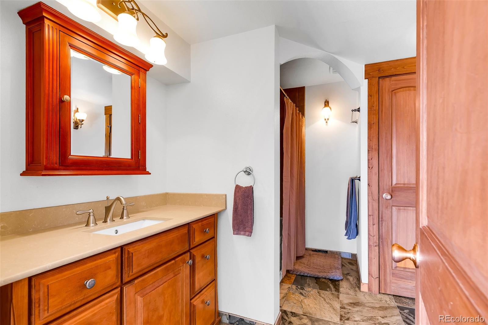 60 Jackson Alma, CO 80420 - Photo 17 of 49 a en suite bathroom with a sink double vanity and a mirror