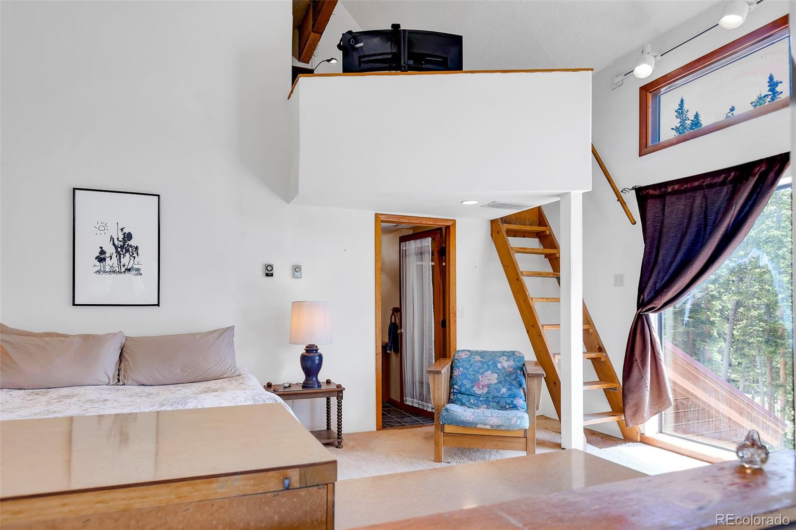 60 Jackson Alma, CO 80420 - Photo 35 of 49 a bedroom with a bed and a large window