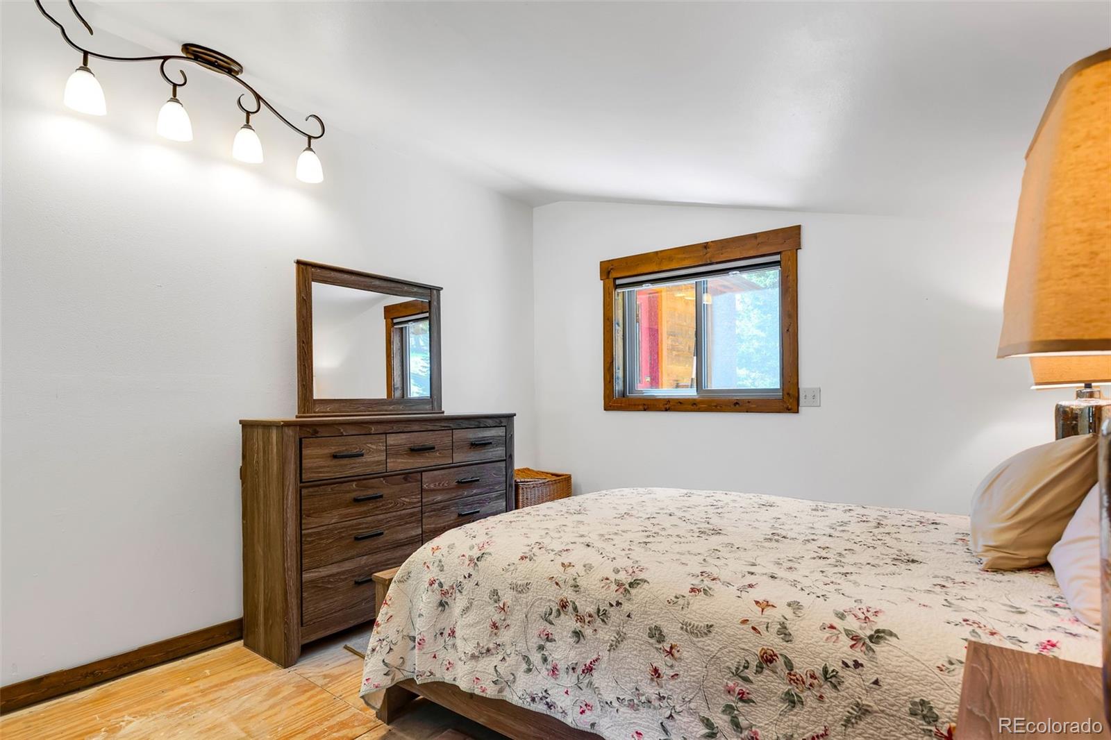 60 Jackson Alma, CO 80420 - Photo 37 of 49 a bedroom with a bed and a dresser