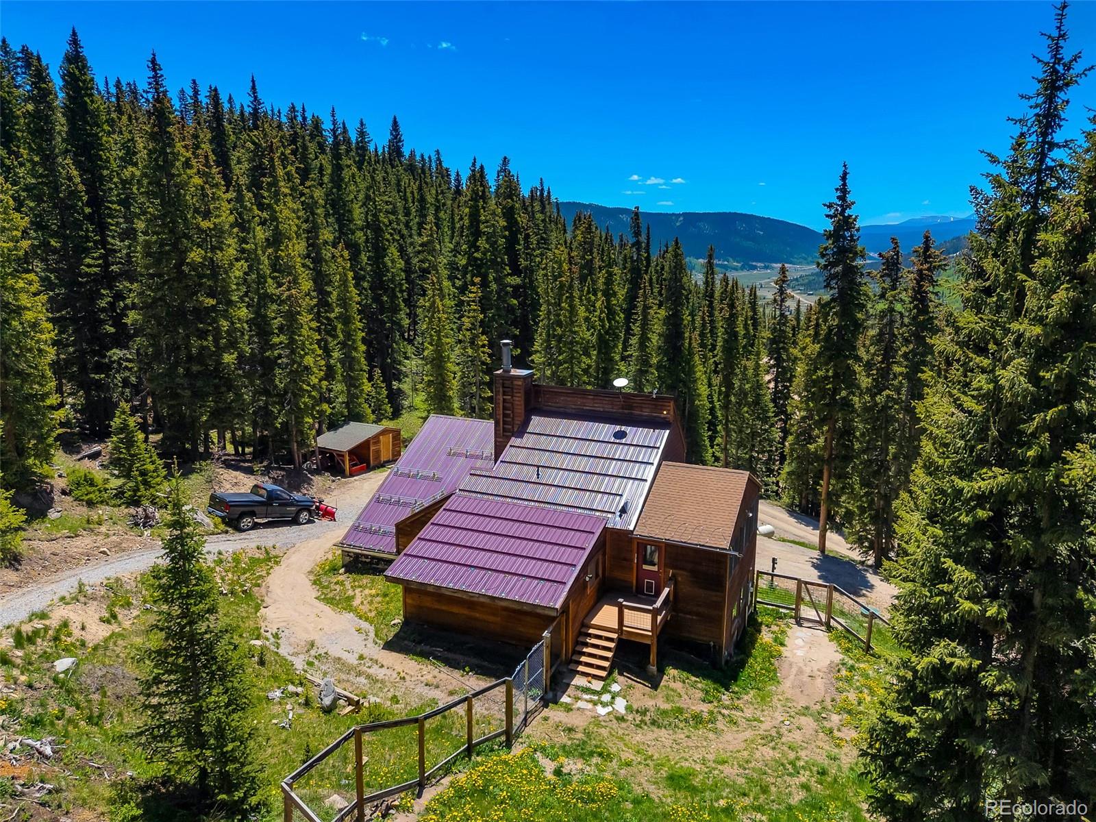 60 Jackson Alma, CO 80420 - Photo 39 of 49 a view of a patio with table and chairs with wooden floor and fence