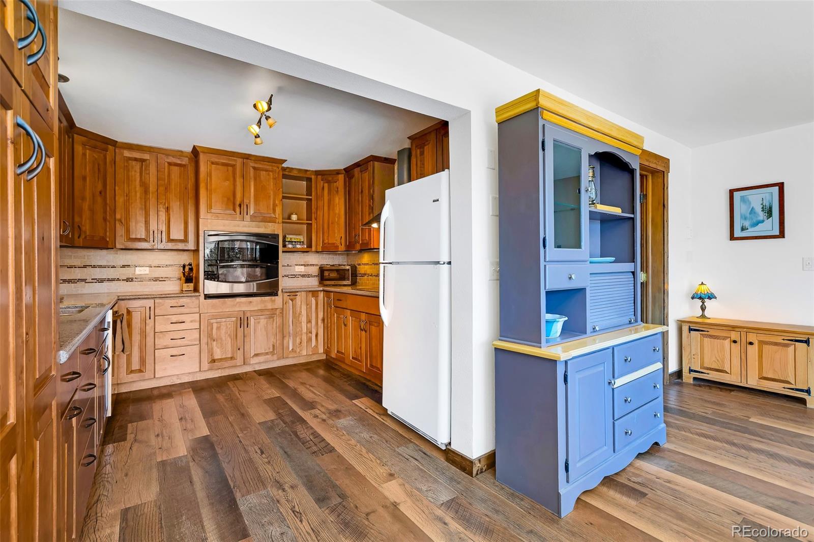 60 Jackson Alma, CO 80420 - Photo 47 of 49 a kitchen with a refrigerator a stove top oven a sink and dishwasher
