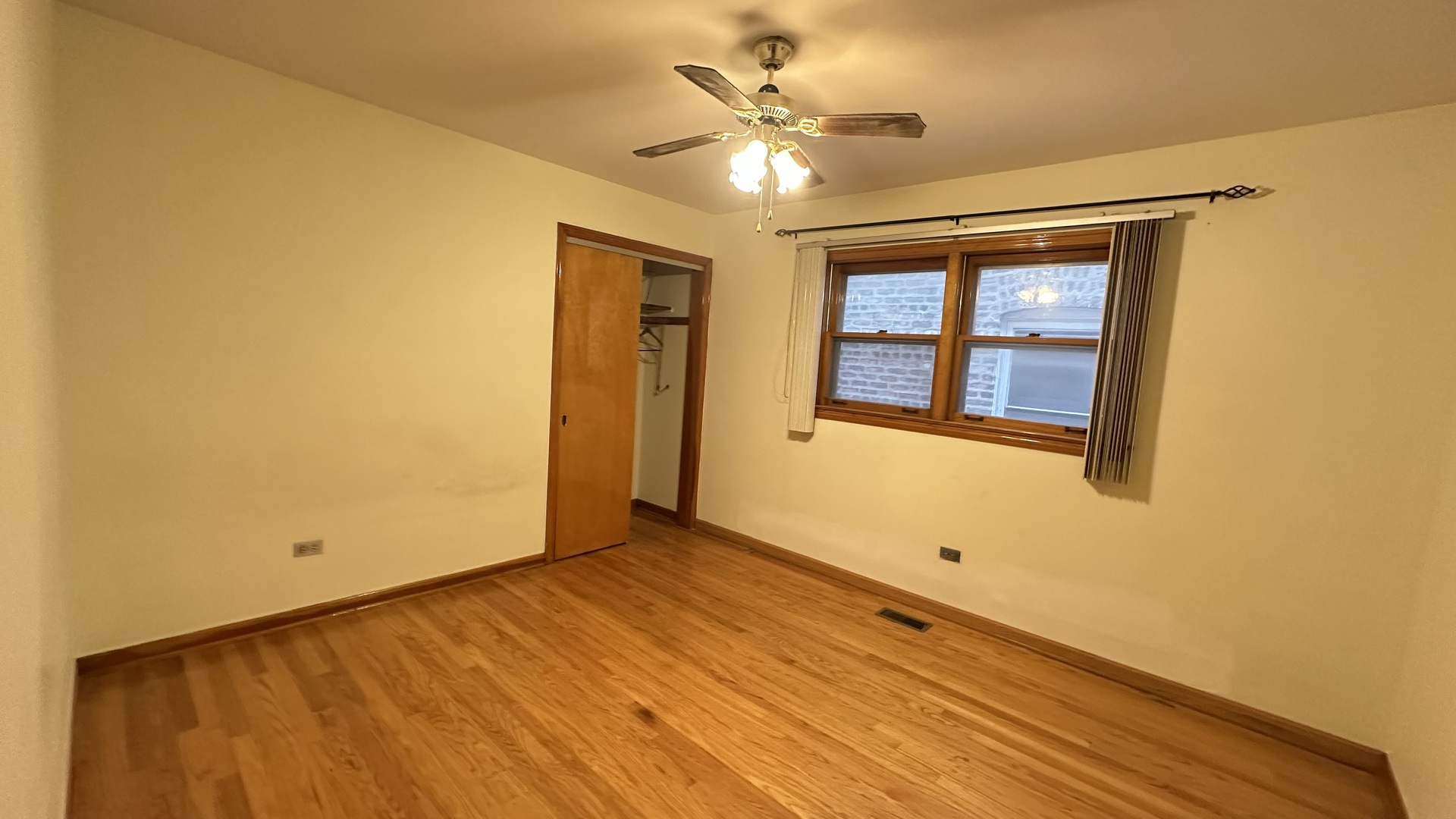 5728 North McVicker Avenue, Unit 1 Chicago, IL 60646 - Photo 4 of 8 a view of an empty room with a window
