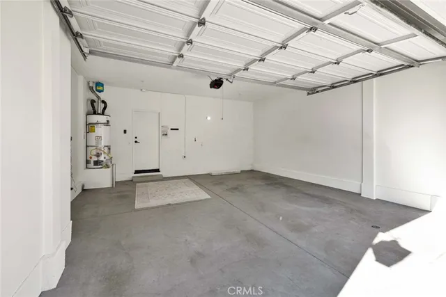 a view of a house with a street and a garage