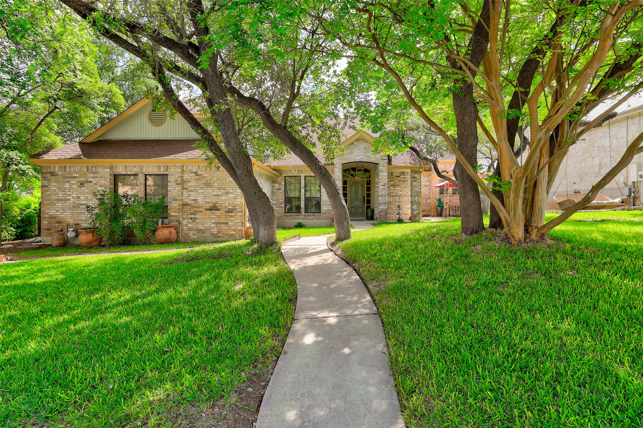 110 South Ridge Circle Georgetown, TX 78628 - Photo 1 of 37 Brick and stone facade residence featuring a front gabled roofline