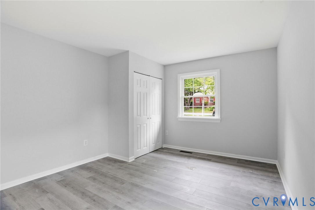 5301 Dalglish Road Richmond, VA 23223 - Photo 27 of 42 Room featuring wood-finish flooring, white baseboa